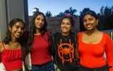 Four students post in red at Spiderman student social
